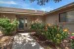 A path of fresh summer roses welcomes you to this cozy Sedona home